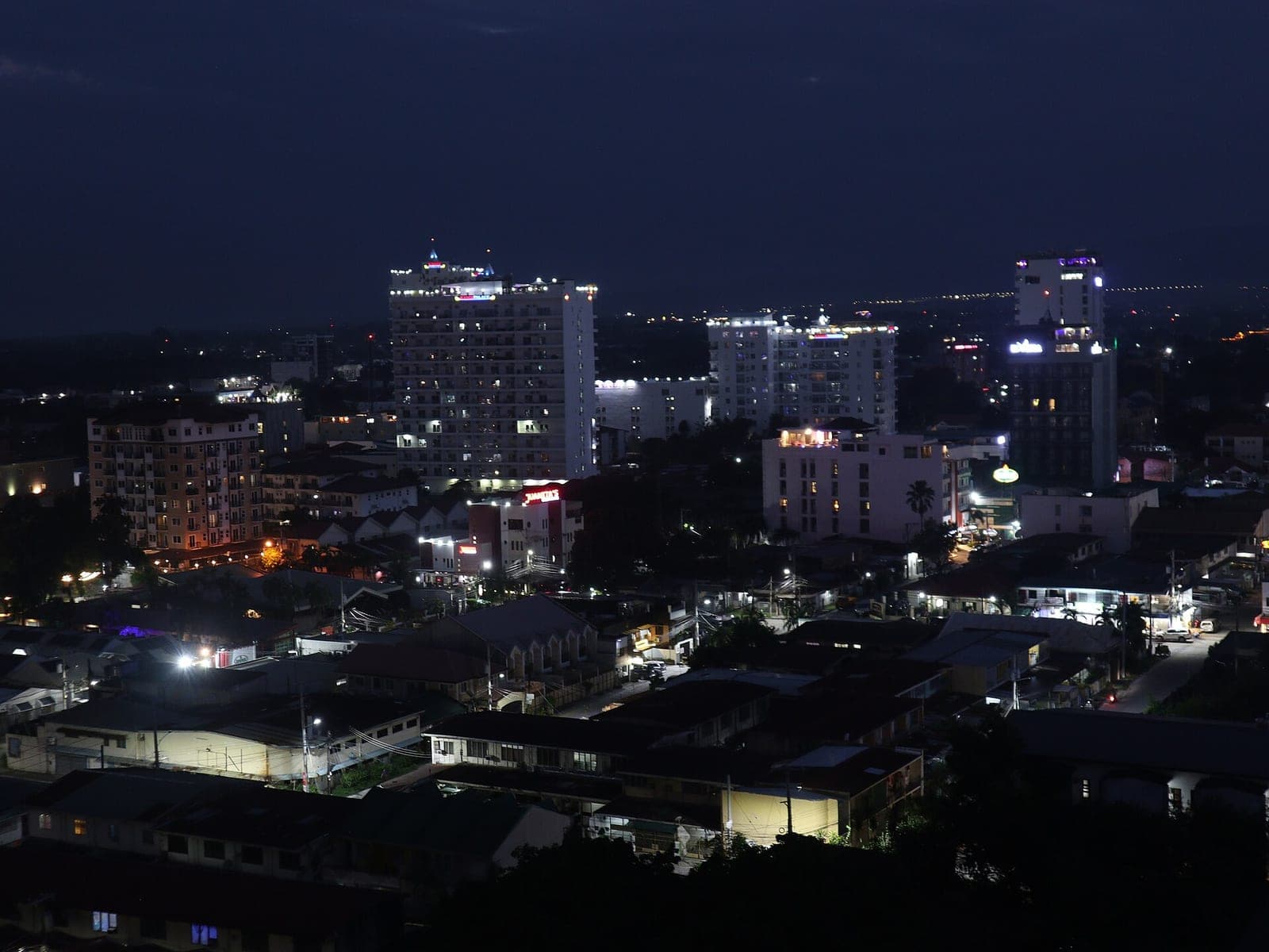 Hotel towers of Malabañas at dusk — the neighbourhood behind Fields Avenue where Central Park Tower stands