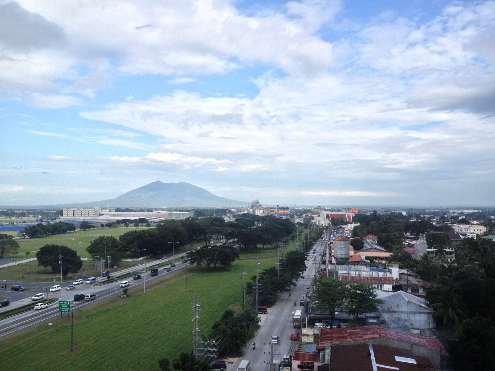 The highway along the Clark Freeport boundary at Angeles City, with Mount Arayat beyond
